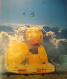 Holga photo, multiple exposure of rubber duck and clouds